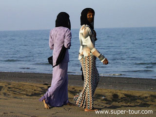 Photo: Arabian beauties on a beach at sunset